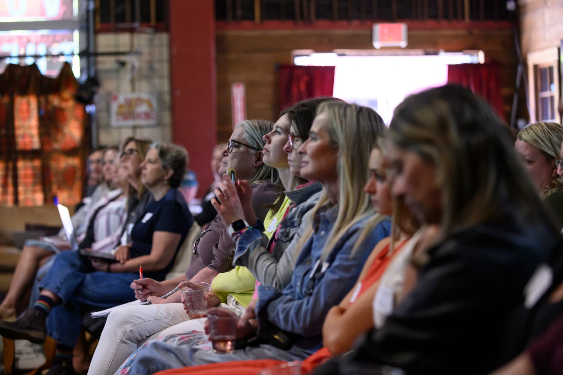 Women seated and listening during the in-person Vibe Coding Workshop